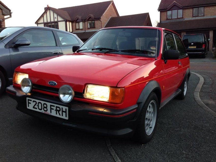 Back on the driveway with the original registration.