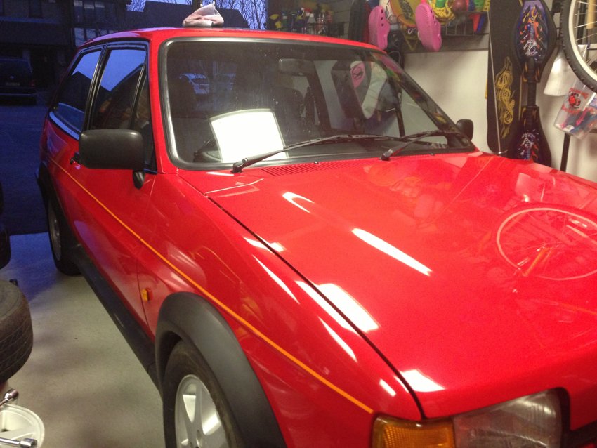 Front bodywork and spotlights pictured in the garage.