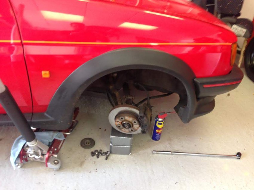 Springs, dampers and other replacement parts laid out in the boot.