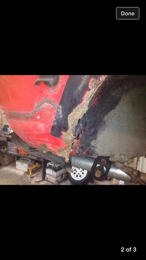 A close-up of the lower bodywork during repairs.