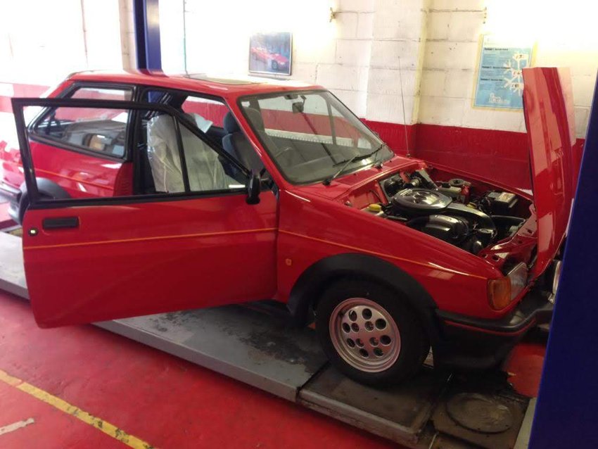 The XR2 on the workshop ramp with the bonnet raised.